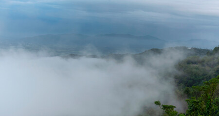 Beautiful Mountain landscape foggy windy mountain range green landscape asian farm. Amazing Landscape mountain green field meadow white cloud blue sky on sunrise. Countryside sunlight heaven scenery