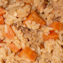 Uzbek pilaf with meat and spices.Pilaf with meat background.Rice with meat and seasonings.