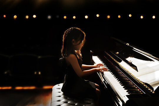 asian girl kids performance play piano in classic music ability for on stage