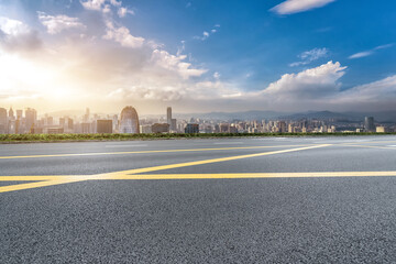 Vibrant Urban Landscape at Sunset with a Road Perspective