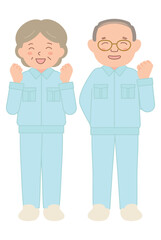 笑顔でガッツポーズをする作業着のシニアスタッフ（全身）