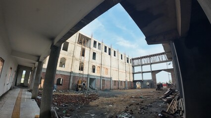 Under-Construction Building Site with Cement Mixer and Scaffolding