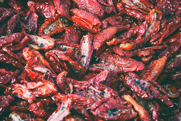 Dried tomatoes abstract background. Dry tomato background