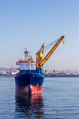 Fototapeta premium the cargo ship and the crane images