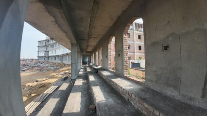 Under Construction Building with Arched Openings and Wooden Scaffolding