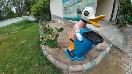 Duck-shaped Trash Can in a Park