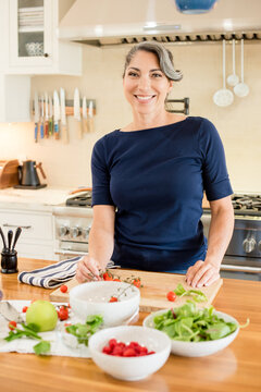 Woman chef preparing food in the kitchen