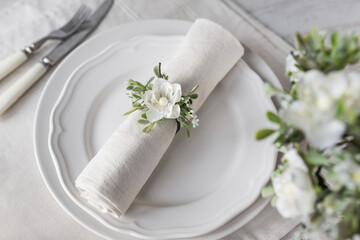 Floral napkin decoration on plates high angle view, spring place setting centerpiece arrangement
