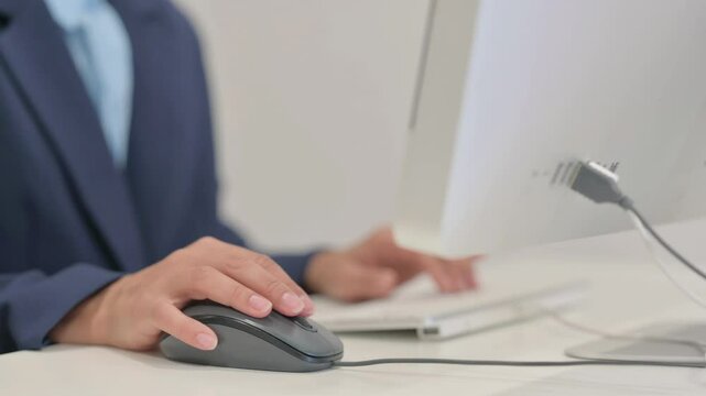 Close up of Businesswoman Using Computer Mouse