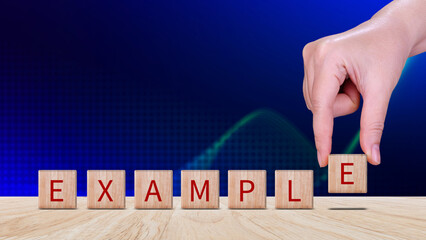 Example concept, Example word written on wooden block, example text on table, Business and example...