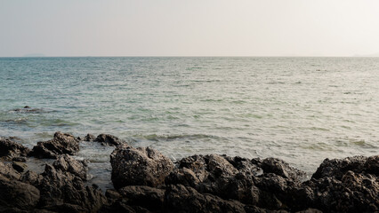 Landscape of rocks by the sea in the evening.