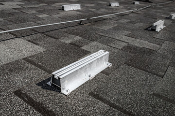Roof mounting brackets for solar panels. Metal bars. European energy conservation technologies....