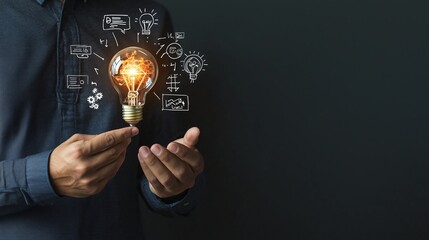 Woman’s hand holding a glowing lightbulb, symbolizing innovation and creativity in business
