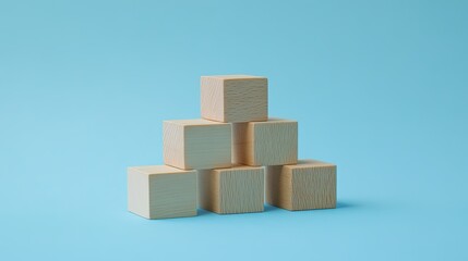 Wooden blocks stacked on a blue background, representing a business growth ladder. The minimalistic setup offers room for copy or branding elements.