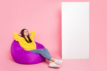 Full size profile side photo of young lady dream hands behind head dream sleepy sit purple chair isolated over pink color background