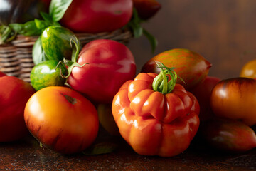 Tomatoes on a brown background.