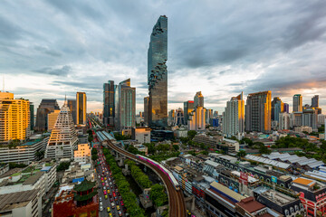 Bangkok skyline and skyscraper with bridge link mass transportation on Sathorn Road center of...