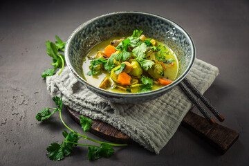 Green curry vegetable soup with mushrooms and cilantro