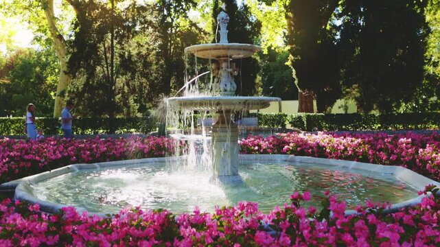 beautiful Park Retiro, fountain with blooming flowers in El Retiro Park, Madrid, sightseeing in Madrid, capital of Spain.