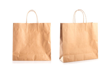 Blank brown paper bag for shop packing, Studio shot against a white background. The eco-friendly...