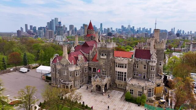 Drone video flying around Casa Loma in Toronto with CN Tower in view