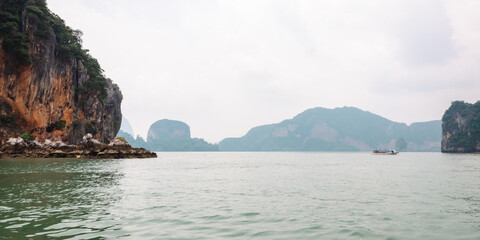 Serene waterscape of iconic limestone cliffs. Mystic Cliffs of Phang Nga Bay