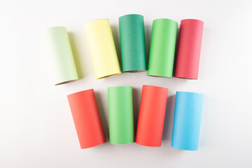 recycled toilet paper roll tubes wrapped in colored paper, step in creative process of making...