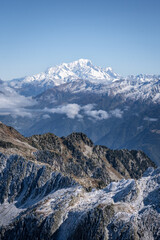 sunning panoramic view of the Mont Blanc in autumn. Snowy mountains in autumn in the french alps. beautiful colors, blue sky, sea of clouds