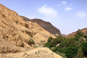 mountain area landscape around the Ma'in hot springs in Jordan (mountain waterfalls with hot water and steam)
