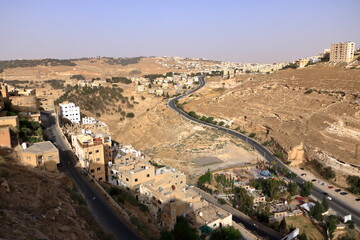 above view of roads and Al-Karak city from castle. Al-Karak (Karak or Kerak) is a city in Jordan known for its Crusader castle