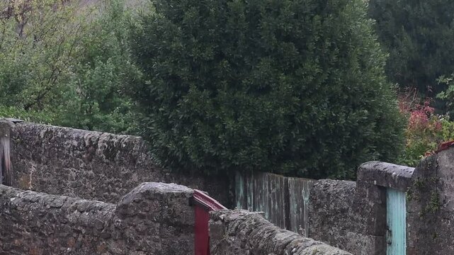 Rainy weather in a mountain village in France in the Auvergne Rhone Alpes region. Rain in autumn.