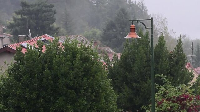 Rainy weather in a mountain village in France in the Auvergne Rhone Alpes region. Rain in autumn.