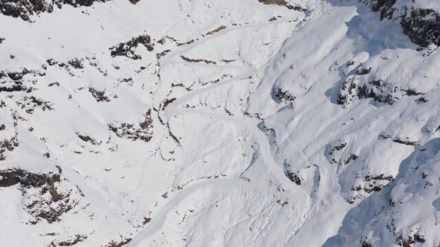 Slow tilt up Sani Pass, buried under thick layer of white snow