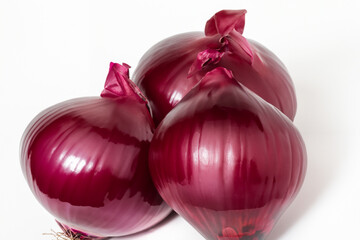 A white with reds and onions. Food fresh healthy concept. A white with red onions and green vegetables. A white with onions, carrots, red onions and other lifestyle vegetables.