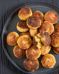 Northern Pike fish cakes on dark grey plate