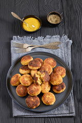 Northern Pike fish cakes on dark grey plate