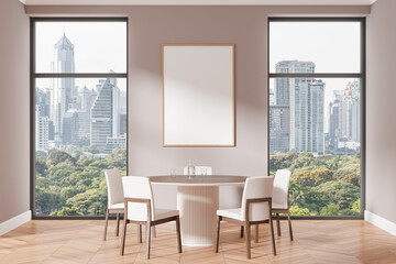 A modern dining room with a blank poster on the wall. Large windows offer a stunning cityscape and greenery. Ideal for artwork display concepts. 3D Rendering