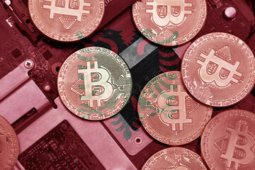 flag of albania on the bitcoins with computer electronic circuit board background. bitcoin concept