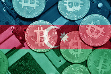 flag of azerbaijan on the bitcoins with computer electronic circuit board background. bitcoin...