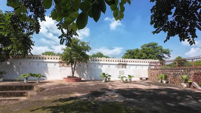 Courtyard of Jamali Kamali tomb and mosque at Mehrauli Delhi , India