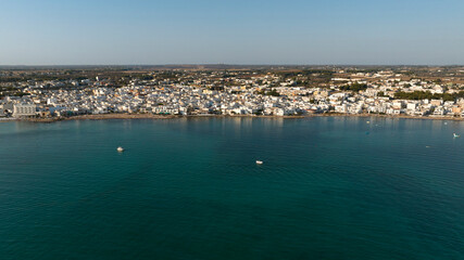Aerial view of Porto Cesareo at sunset. It is a small city on the Mediterranean Sea in the province of Lecce, Italy. It is a tourist town located on the Ionian coast of the Salento peninsula.