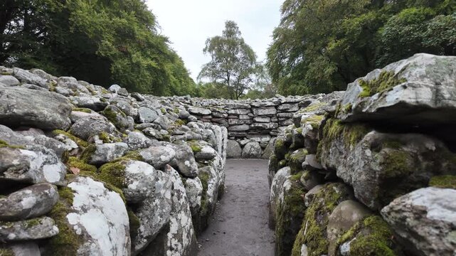 POV shot walking into a prehistoric tomb at Clava Cairns