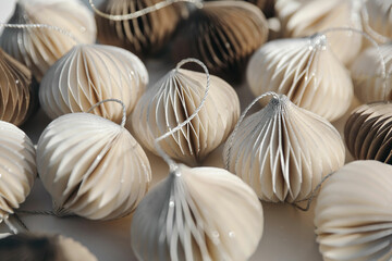 Sustainable, environmentally friendly, plastic free Christmas bauble decorations on table. White, natural brown glittering Christmas balls texture. Festive winter banner. Selective focus, blurred