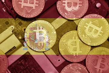 flag of spain on the bitcoins with computer electronic circuit board background. bitcoin concept