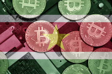 flag of suriname on the bitcoins with computer electronic circuit board background. bitcoin concept
