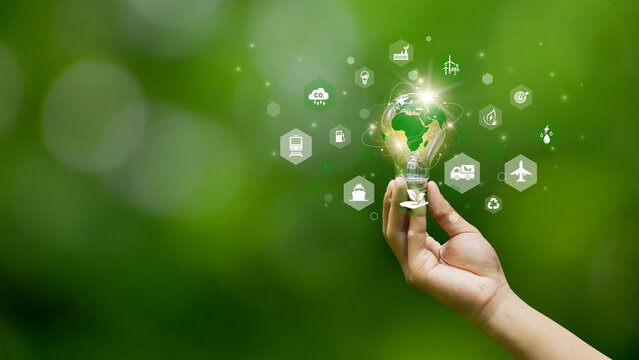 Green Logistic and Clean energy concept. The lightbulb is surrounded by icons for sustainability transportation, renewable energy and CO2 reduction. eco-friendly transport. supply chain. electric.