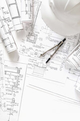 architect design working drawing sketch plans blueprints and making architectural construction model in architect studio,flat lay.