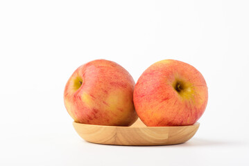 Fresh ripe apple with tiny water drops on white background