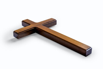 Wooden religion cross isolated over white background. Religious christian holiday. Symbol of faith in God, Christianity Feast, Easter, Good Friday, Palm Sunday