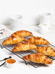 freshly baked delicious croissants with apricot jam